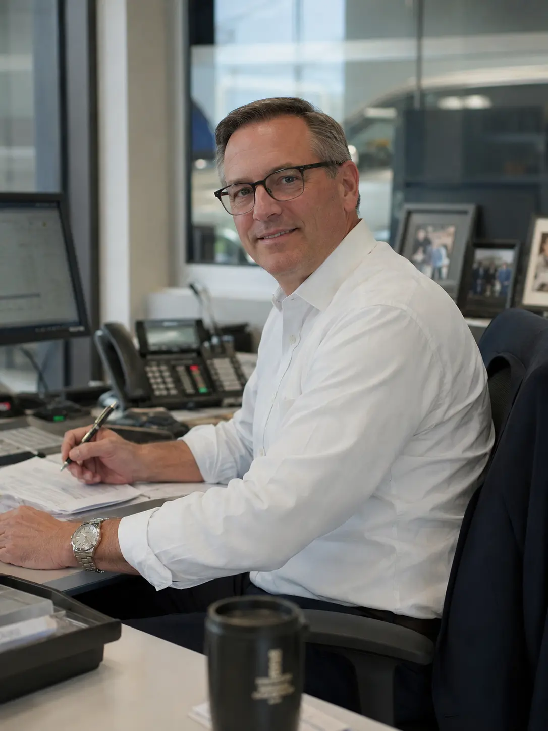 A dealer principal reviewing call coverage and store performance